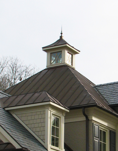 Copper finial installation on copper roof